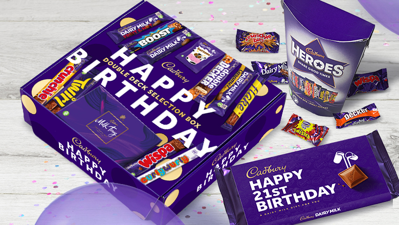 A Cadbury Happy Birthday box, Pack of Heroes and Dairy Milk bar with Happy 21st Birthday message